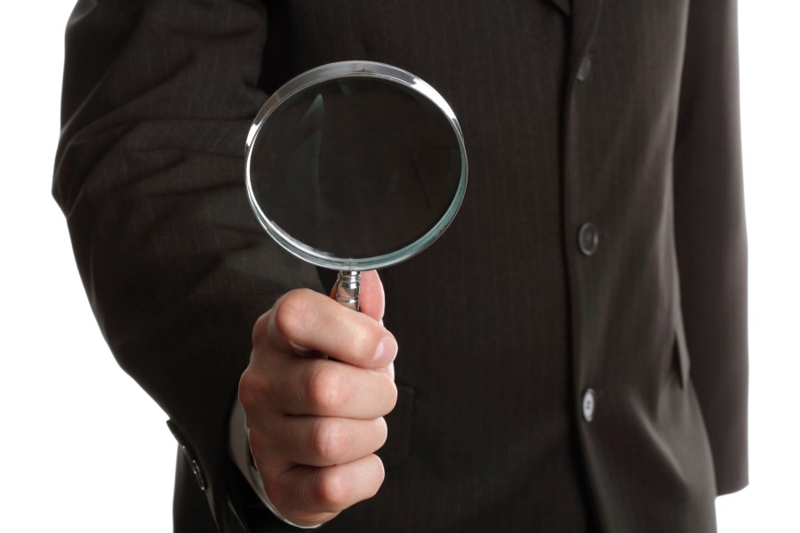Businessman with magnifying glass