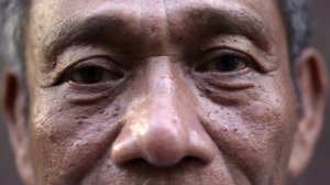 stock-footage-depression-and-sadness-of-depressed-and-sad-mature-asian-man-looking-at-camera-extreme-close-up-of