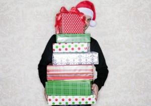 1206_holiday-overspending-intro-pile-gifts_485x340